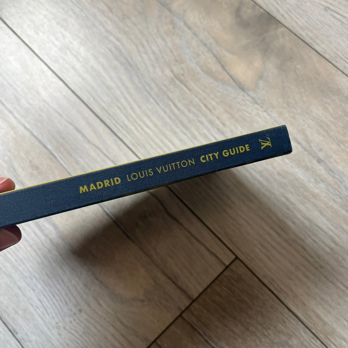 Louis Vuitton “Madrid” City Guide is a 320-page English-language travel book with cloth binding. It features contributions from writers Stephen Phelan, Ian Mount, Michael Stothard, and Joanna Wivell, with a special guest contribution from Sara Hurtado. Photography is provided by Mat Jacob of the Tendance Floue collective, offering curated insights into Madrid’s hotels, restaurants, cultural landmarks, and creative hubs