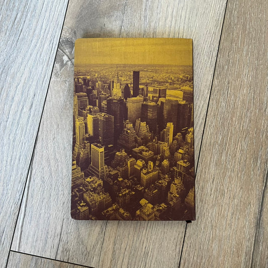Louis Vuitton “New York” City Guide is an English-language travel book with cloth binding, featuring contributions from writers Carole Sabas, Marie Salomé Peyronnel, Aude Revier, and Fabrice Gaucher. The guide includes special guest contributions from Hank Willis Thomas and Rujeko Hockley, with exclusive photography by Pascal Aimar. It covers New York’s hotels, restaurants, cultural landmarks, and creative hubs, providing curated insights into the city’s art, design, gastronomy, and culture.