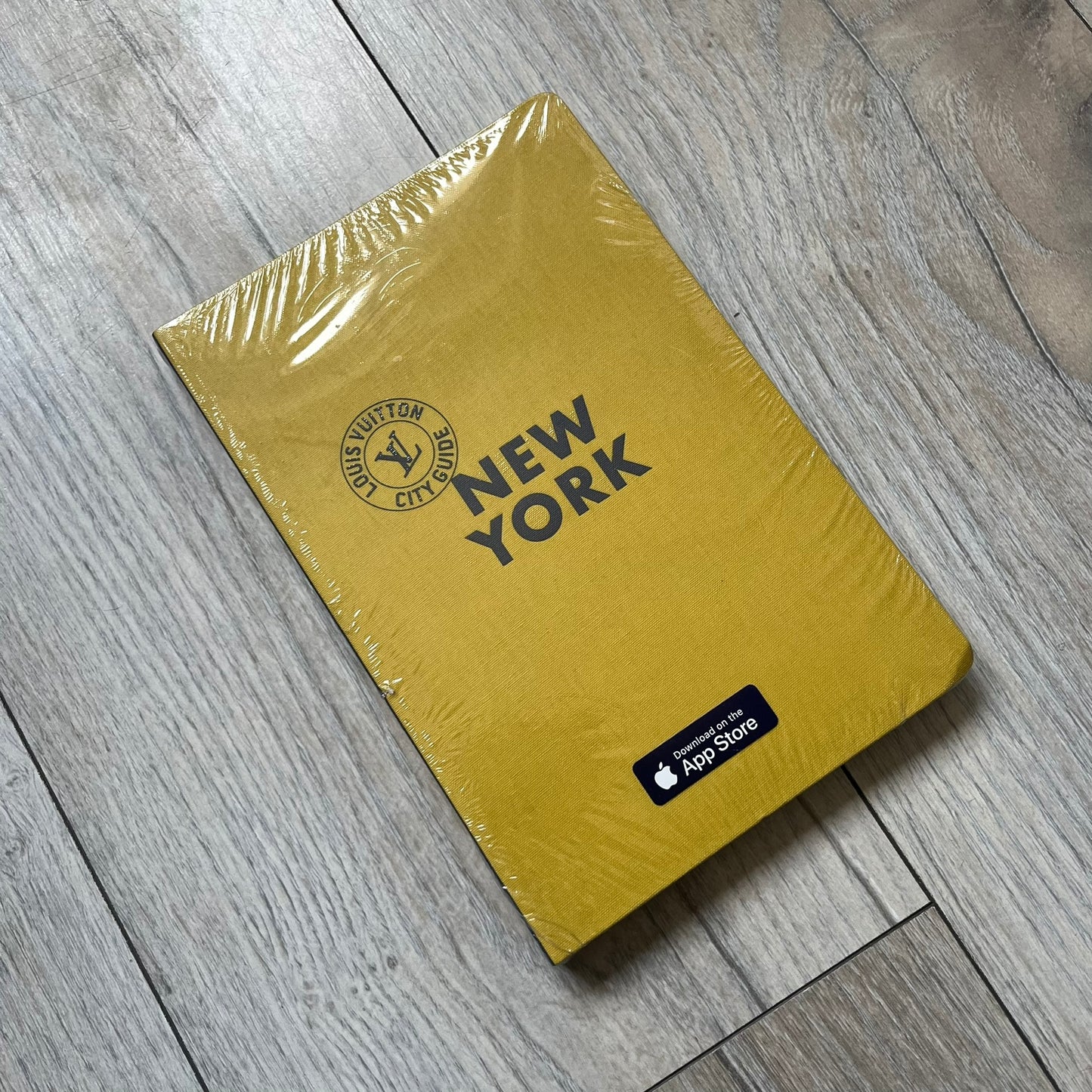 Louis Vuitton “New York” City Guide is an English-language travel book with cloth binding, featuring contributions from writers Carole Sabas, Marie Salomé Peyronnel, Aude Revier, and Fabrice Gaucher. The guide includes special guest contributions from Hank Willis Thomas and Rujeko Hockley, with exclusive photography by Pascal Aimar. It covers New York’s hotels, restaurants, cultural landmarks, and creative hubs, providing curated insights into the city’s art, design, gastronomy, and culture.