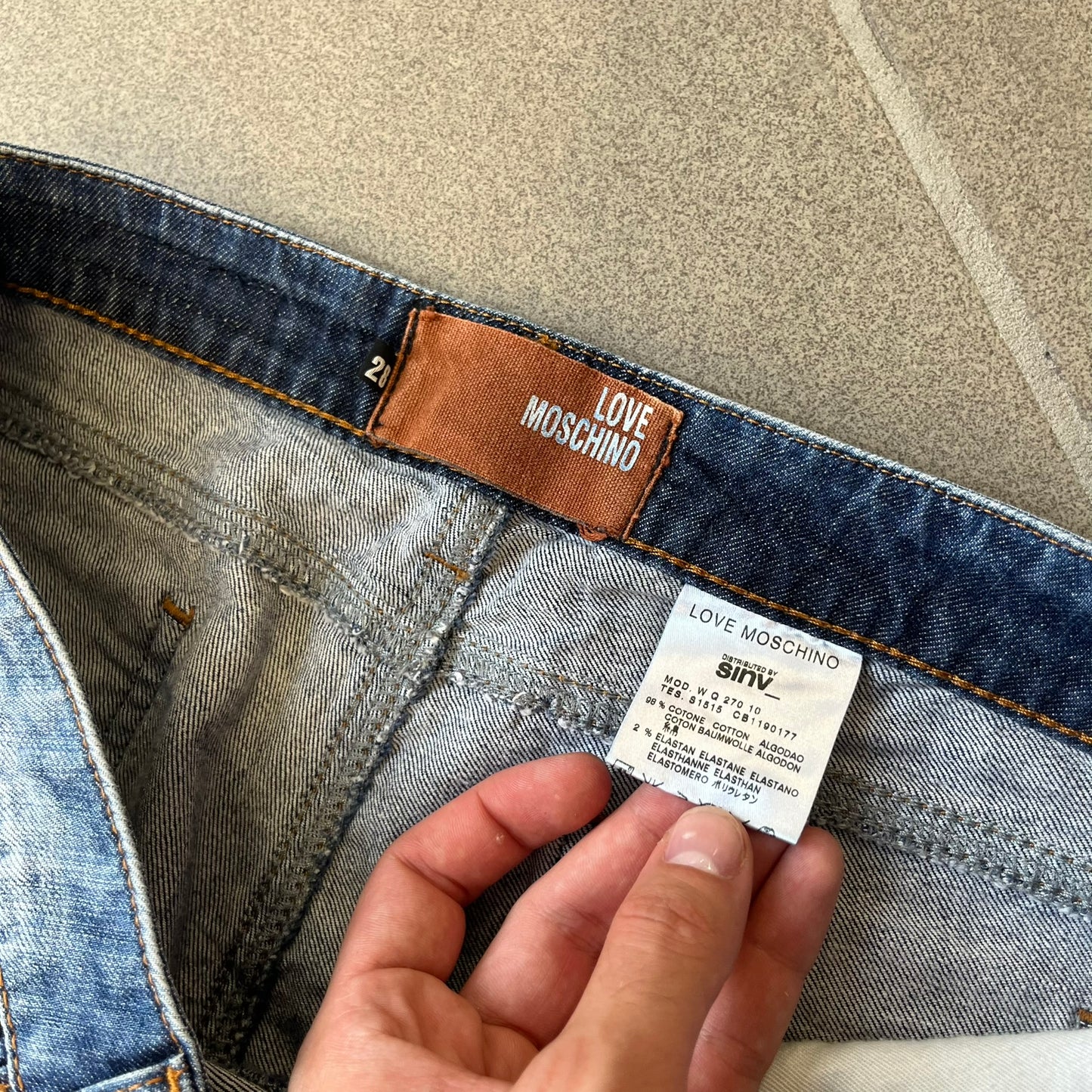 Love Moschino Hearts Bootcut Jeans feature blue denim with a white washed effect around the knees and a bootcut construction. They have a gold-tone Love Moschino button and two back pockets with raised horizontal heart-shaped stitching. Made from 98% cotton and 2% elastane.
