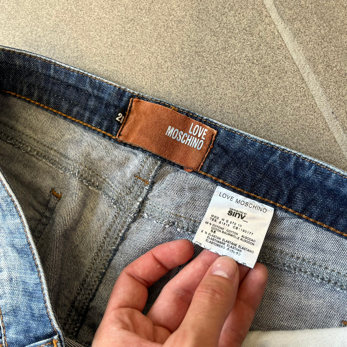Love Moschino Hearts Bootcut Jeans feature blue denim with a white washed effect around the knees and a bootcut construction. They have a gold-tone Love Moschino button and two back pockets with raised horizontal heart-shaped stitching. Made from 98% cotton and 2% elastane.
