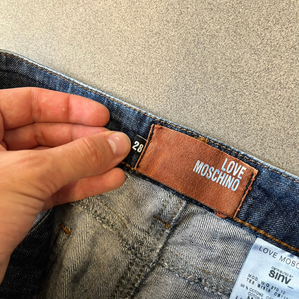 Love Moschino Hearts Bootcut Jeans feature blue denim with a white washed effect around the knees and a bootcut construction. They have a gold-tone Love Moschino button and two back pockets with raised horizontal heart-shaped stitching. Made from 98% cotton and 2% elastane.
