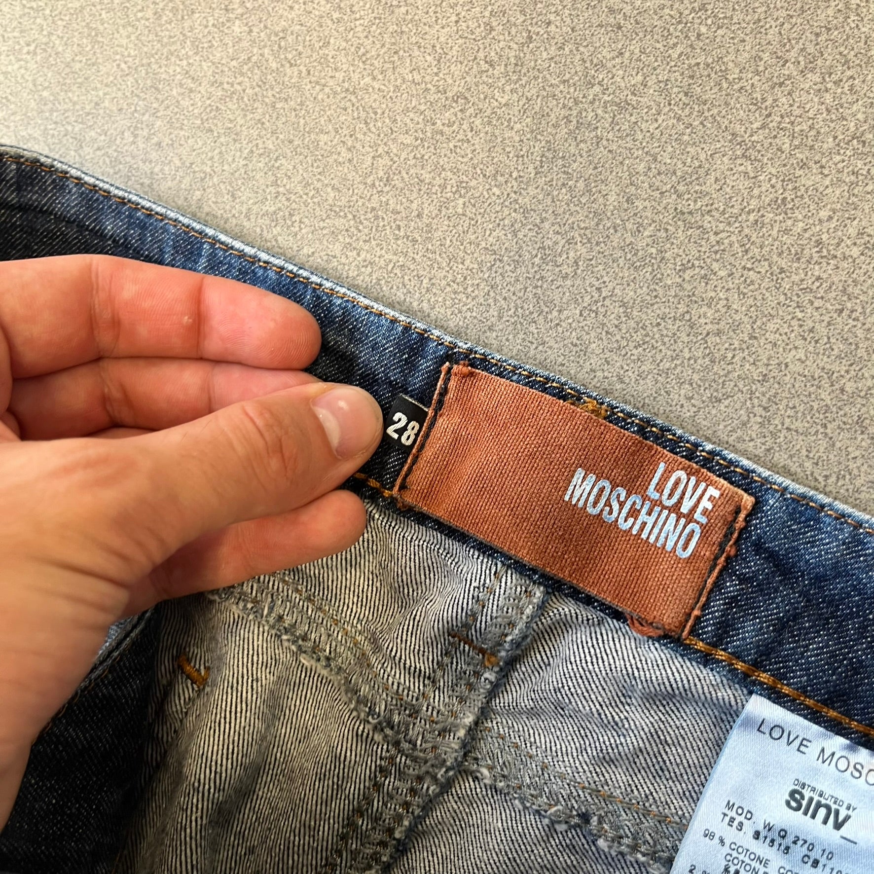 Love Moschino Hearts Bootcut Jeans feature blue denim with a white washed effect around the knees and a bootcut construction. They have a gold-tone Love Moschino button and two back pockets with raised horizontal heart-shaped stitching. Made from 98% cotton and 2% elastane.
