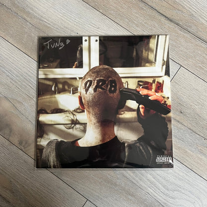 Lucki Drgs R Bad* 2026 Signed BRAZY 4 LUCKI Vinyl is a 2xLP release of Lucki’s fourth studio album, originally released on May 15, 2026. The set includes alternative front and back artwork, a widespine jacket, and printed inner sleeves with different graphics for each record. The vinyl records are transparent orange with black smoke effects throughout. The outer jacket features artwork of a girl shaving her head with the DRB logo cut into her hair. This copy is signed by Lucki in the upper left corner with 