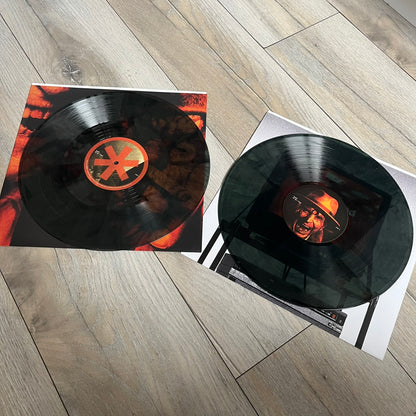 Lucki Dr*gs R Bad 2026 Signed Meet Me @ Viper Room Vinyl is a 2xLP release of Lucki’s fourth studio album, originally released on May 15, 2026. The set includes alternative front and back artwork, a widespine jacket, and printed inner sleeves with different graphics for each record. The vinyl records are transparent black with black smoke effects throughout. The outer jacket features artwork of a person drowning in a pool filled with money. This copy is signed by Lucki in the upper left corner with the insc