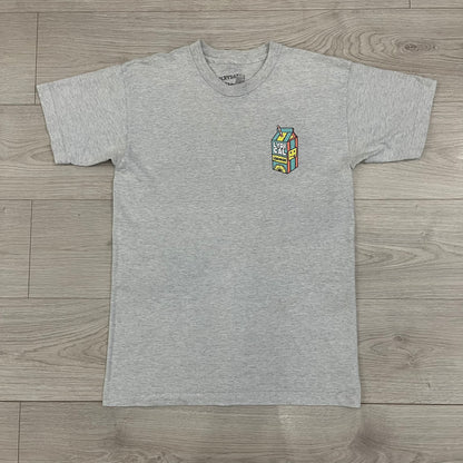Lyrical Lemonade Everyday Essentials Gray T-Shirt in a gray colorway. Features a small Lyrical Lemonade carton graphic with an xP face printed on the left chest. The back displays a large Lyrical Lemonade logo with text and carton graphics in blue, yellow, and pink, from the Everyday Essentials line.