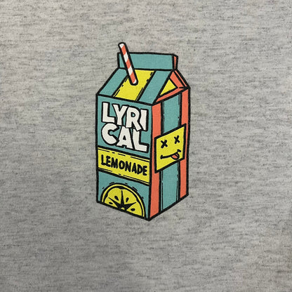 Lyrical Lemonade Everyday Essentials Gray T-Shirt in a gray colorway. Features a small Lyrical Lemonade carton graphic with an xP face printed on the left chest. The back displays a large Lyrical Lemonade logo with text and carton graphics in blue, yellow, and pink, from the Everyday Essentials line.