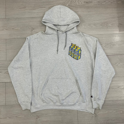 Champion x Lyrical Lemonade Grey Hoodie featuring a triple overlaping lemonade cartoon patch design on the front left chest. Made from a 50/50 cotton-polyester, this medium ash grey hoodie includes a two-ply hood, dyed-to-match drawcord, front pouch pocket, and embroidered Champion logo on the wrist.