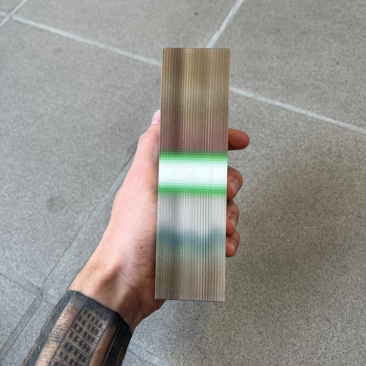 MSCHF Blur A$50 AUD Figure released on May 24rd 2022. The collectible object is designed as a stack of 50 Australian Dollars banknotes with a blurred sculptural effect across the entire surface. The piece recreates the appearance of a money stack while distorting the printed details, giving it a block-like form resembling a stylized or game-like currency bundle.