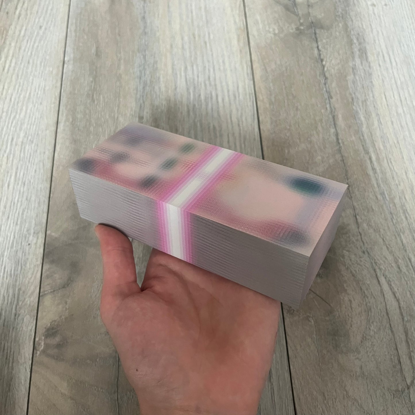 MSCHF Blur د.إ 100 Dirham Figure is an art object released on March 14, 2022, as part of MSCHF’s Blur series. The piece replicates a 100 UAE dirham banknote in a deliberately blurred physical form, continuing the concept of “ecommerce performance art” where the product appears visually obscured both online and in reality. It was released as part of the Spring/Summer 2022 lineup
