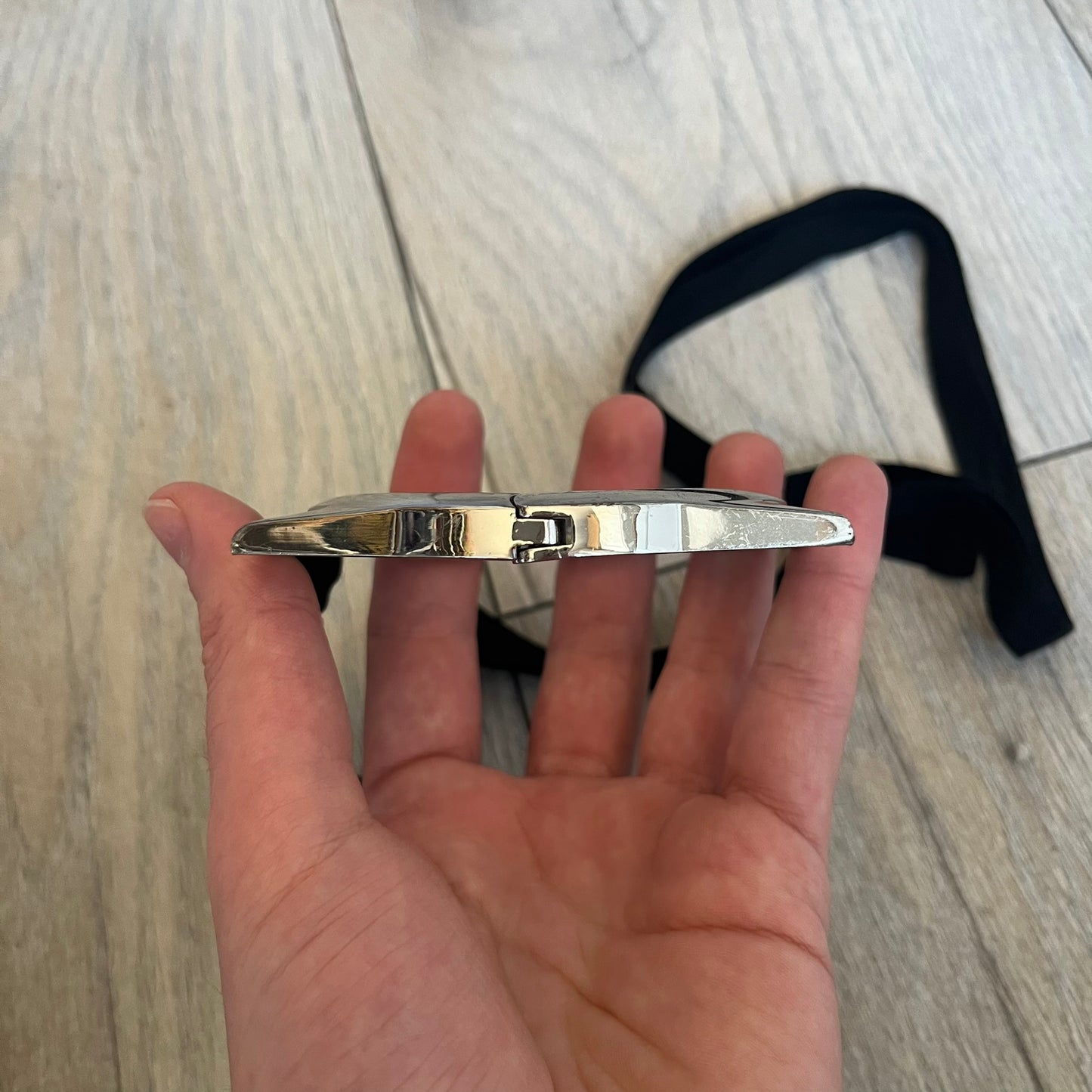 Maison Margiela x H&amp;M AW09 Enlarged Watch Frame Bracelet is a stainless steel bracelet from the 2012 collaboration between Maison Margiela and H&amp;M, based on an original Autumn/Winter 2009 design. The piece is shaped like an oversized watch case but functions as a bracelet, featuring a side clasp opening mechanism. It includes engraved tonal branding on the interior and can also be worn as a pendant. Made in Italy, it comes with the original box, dustbag, and tags.