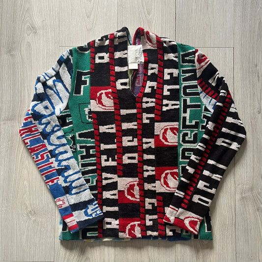 Collection of patterned scarves with visible branding on a wooden surface