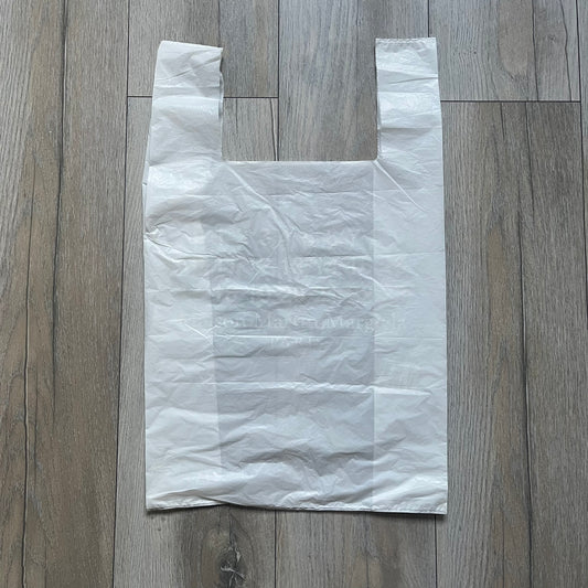 Clear/white plastic bag from the Maison Margiela x H&amp;M collaboration, designed with a cut-off bottom that allows it to be worn as a top or tank. Features big Maison Margiela x H&amp;M logos printed on the front, visible through the semi-transparent material.