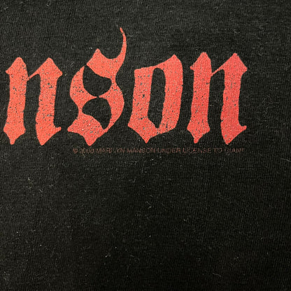 Marilyn Manson Holy Wood Face Tee from 2000, made on a black BG blank. Features a large front graphic of Manson’s face with signature white makeup, red accents, and eye contact. The back includes red Marilyn Manson text with a small 2000 Giant license, great piece from the Holy Wood era.
