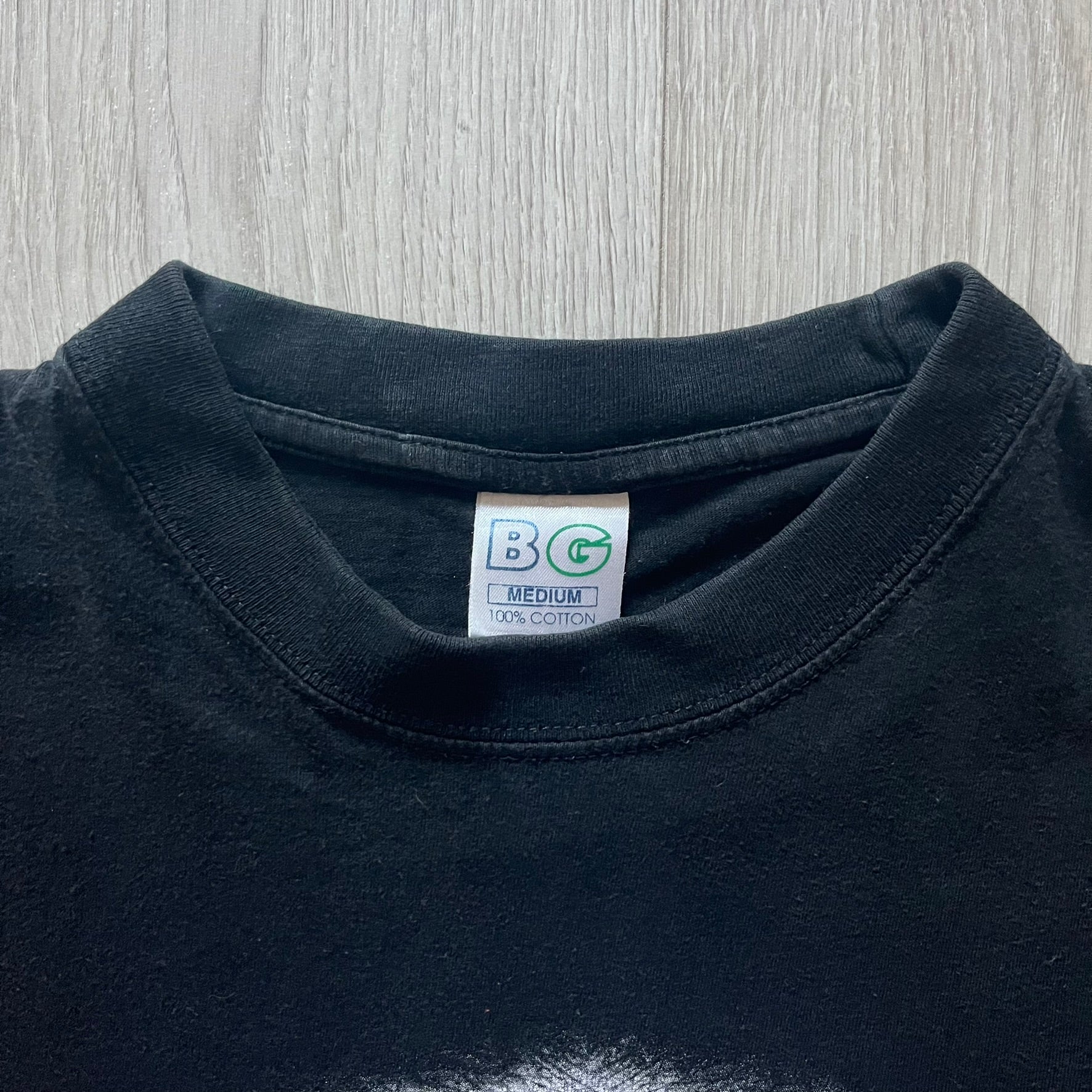 Marilyn Manson Holy Wood Face Tee from 2000, made on a black BG blank. Features a large front graphic of Manson’s face with signature white makeup, red accents, and eye contact. The back includes red Marilyn Manson text with a small 2000 Giant license, great piece from the Holy Wood era.