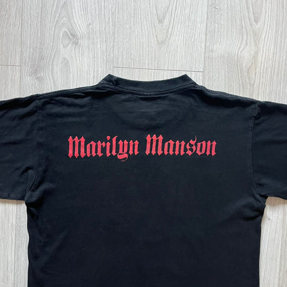 Marilyn Manson Holy Wood Face Tee from 2000, made on a black BG blank. Features a large front graphic of Manson’s face with signature white makeup, red accents, and eye contact. The back includes red Marilyn Manson text with a small 2000 Giant license, great piece from the Holy Wood era.