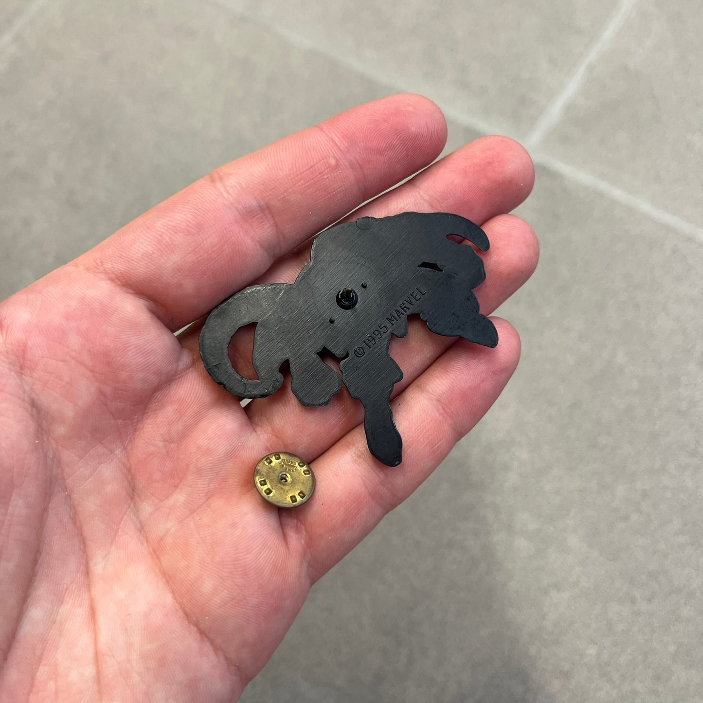 Marvel 1995 The Lizard Pin features a colorful 2D cartoon-style depiction of The Lizard (Dr. Curtis Connors). The back is black with official 1995 Marvel licensing and includes a standard pin fastening.
