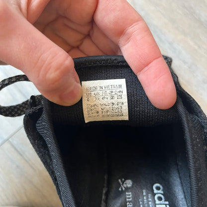 Mastermind x adidas NMD XR1 “Mastermind” Sneakers BA9726 are a 2016 collaboration between adidas and Mastermind Japan, the Japanese label founded by Masaaki Homma. The sneaker features a Core Black/Core Black/White colorway with a polyester mesh upper, rubber sole, and adidas Boost midsole. Mastermind’s signature skull and crossbones logo appears on the leather cage and tongue, while the pair includes black laces and follows the NMD XR1 silhouette released on September 20, 2016 under style code BA9726