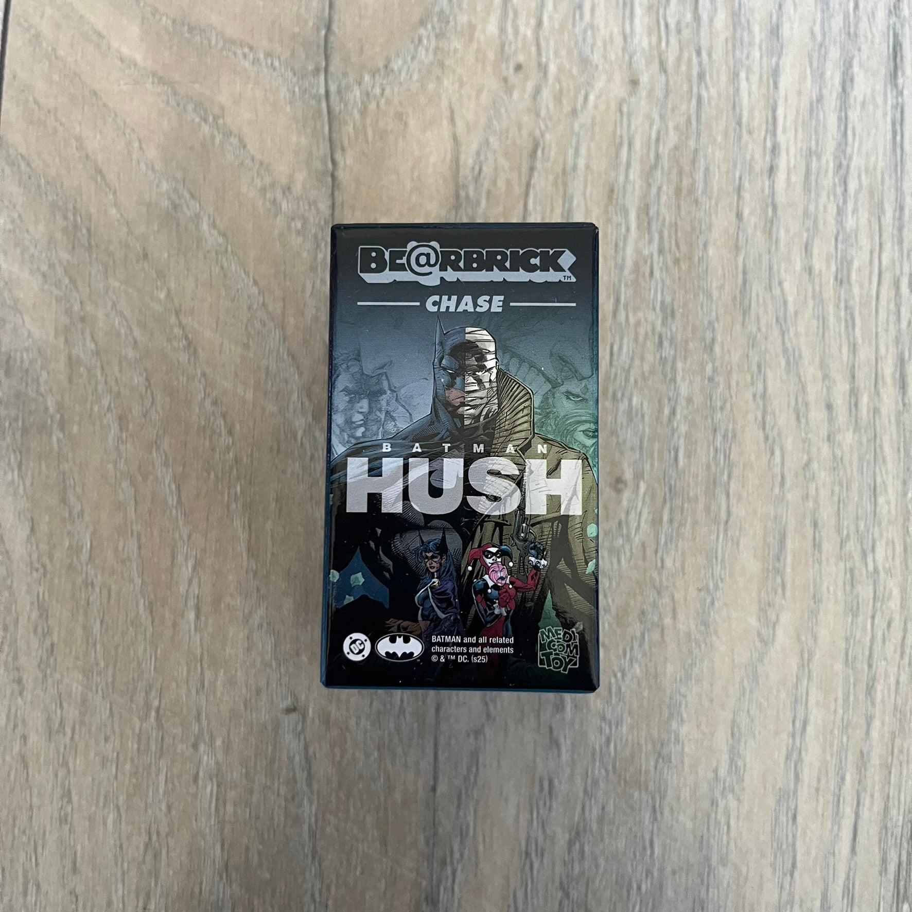 Medicom Toy BE@RBRICK 100% Chase Batman: Hush Series Blind Box (Series 1) is a collectible figure release from Medicom Toy based on the comic storyline Batman: Hush. Each blind box contains one random 100% scale BE@RBRICK figure with articulation at the neck, shoulders, and hips. The lineup includes characters such as Batman, Superman, Catwoman, The Joker, Harley Quinn, and Hush, with the specific figure only revealed upon opening.
