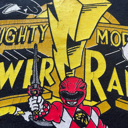 1994 Power Rangers tee with striking full-team graphic, officially licensed by Saban Entertainment. Crafted on a Delta USA-made blank with single stitch finish for authentic vintage feel. Perfect for fans and collectors of classic ‘90s TV.