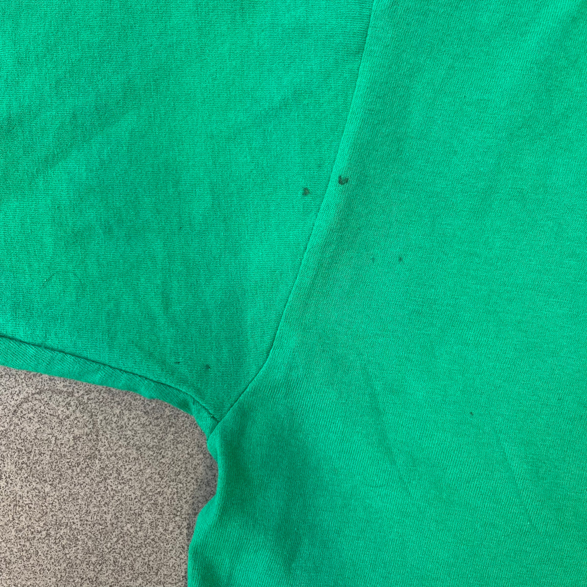 Minecraft 2015 Minecon London Green Tee is a green T-shirt made for Minecon 2015 in London, featuring Big Ben with a Creeper face on the front, with “Minecon London July 4-5” text in Minecraft-style lettering. The upper back displays “Minecon” with “Thanks for Playing” text below, while the sleeves carry a Mojang logo on one side and a Microsoft logo on the other.