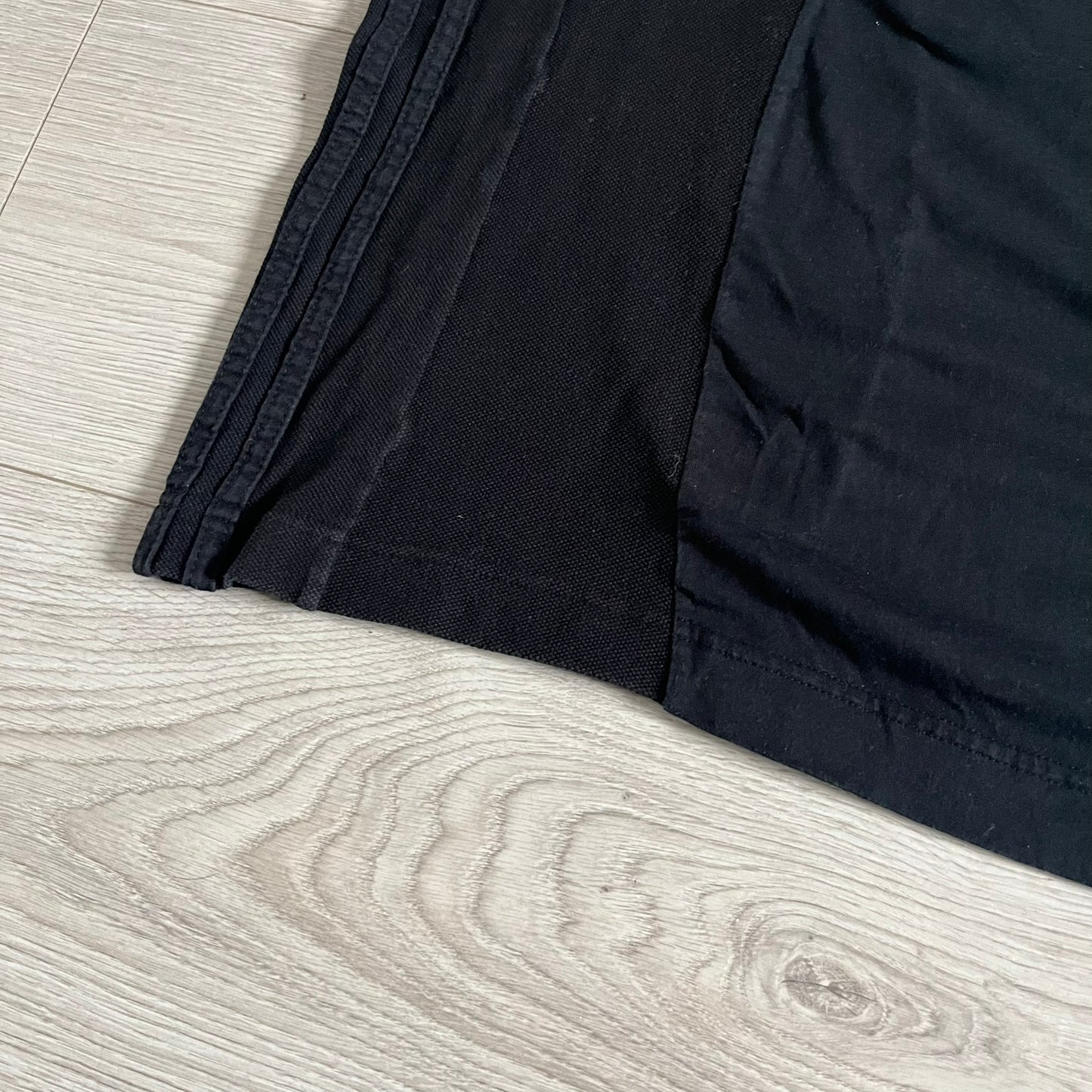 Moncler x Adidas Originals Longsleeve from the FW23 collection. Crafted in cotton jersey, the piece features a three-panel color-block design transitioning from beige to black tones. It includes a silicone chest logo, black Adidas stripes down the sleeves, and a co-branded Moncler x Adidas logo patch on the arm.