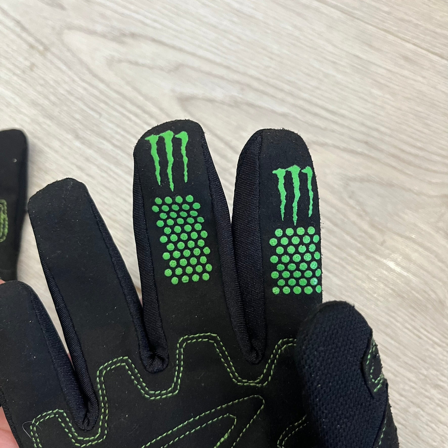 O’Neal’s Monster “Ricky Dietrich” Gloves combine professional racing technology with an iconic Monster Energy aesthetic. Designed for motocross and mountain biking, they feature a black base, green highlights, and bold Monster logos for maximum visual impact. Known for fit, control, and durability, these O’Neal riding gloves reflect over 30 years of performance innovation.