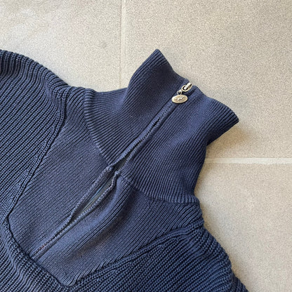 Mustang Jeans Navy Troyer Sweater is a heavyweight, high-quality navy troyer sweater featuring a Mustang Jeans patch tag on the lower front and a silver-colored horse zipper pull. The design includes a collar typical of the troyer style.