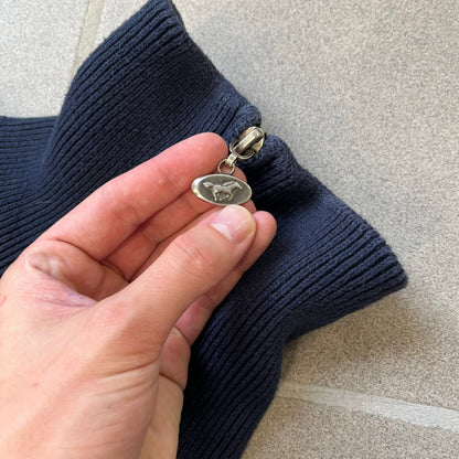 Mustang Jeans Navy Troyer Sweater is a heavyweight, high-quality navy troyer sweater featuring a Mustang Jeans patch tag on the lower front and a silver-colored horse zipper pull. The design includes a collar typical of the troyer style.