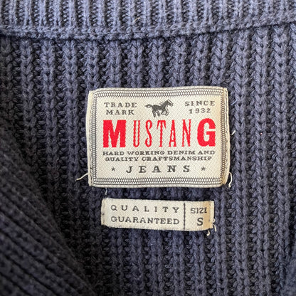 Mustang Jeans Navy Troyer Sweater is a heavyweight, high-quality navy troyer sweater featuring a Mustang Jeans patch tag on the lower front and a silver-colored horse zipper pull. The design includes a collar typical of the troyer style.