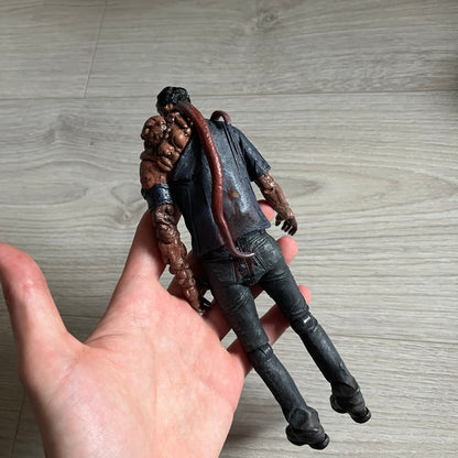 NECA Left 4 Dead Smoker Action Figure released in September 2012, based on the iconic zombie from Valve’s hit game L4D. Standing at 7-inch (1/12 scale), this plastic figure features detailed sculpting, articulation, and originally included a bendable tongue for dynamic posing (missing in this piece).