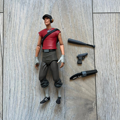 NECA Team Fortress 2 RED Scout Series 4 action figure from 2018. The figure measures approximately 7 inches in scale and recreates the Scout character from Valve’s Team Fortress 2 with game-accurate styling. It features more than 25 points of articulation and comes with three weapons: a scattergun, pistol, and bat.
