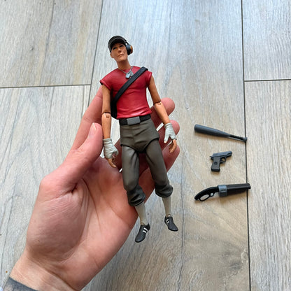 NECA Team Fortress 2 RED Scout Series 4 action figure from 2018. The figure measures approximately 7 inches in scale and recreates the Scout character from Valve’s Team Fortress 2 with game-accurate styling. It features more than 25 points of articulation and comes with three weapons: a scattergun, pistol, and bat.