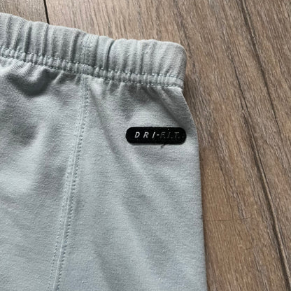 Nike 90’s Challenge Court Tennis Skirt is a baby blue women’s tennis skirt made in Thailand. It features a small green and red Nike Court logo patch at the lower hem, a Dri-FIT patch at the top, and an adjustable waistband with drawstrings.&nbsp;