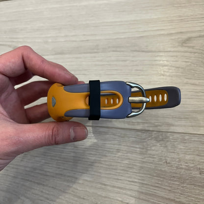 Nike ACG Thermal Gauge Watch featuring an ani-digi display with temperature, date, timer, alarm, and counter functions. Designed with a durable stainless-steel and plastic build, a white dial with grey outline, and an orange strap with the ACG logo. Water-resistant up to 50m, this Nike ACG outdoor watch blends utility with signature 90s–2000s adventure styling.