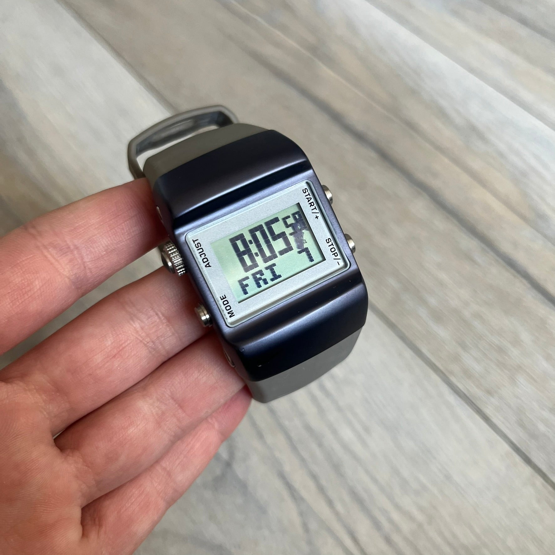 Nike Anvil Comold Reg Digital Watch WC0038 is a digital wristwatch featuring a dark purple/violet aluminum and stainless steel case with a white-outlined display. The watch includes four side buttons, a digital screen, and grey rubber straps, constructed from a mix of aluminum, stainless steel, and plastic. It is water resistant up to 100 meters, powered by fresh batteries, and comes with the original box.