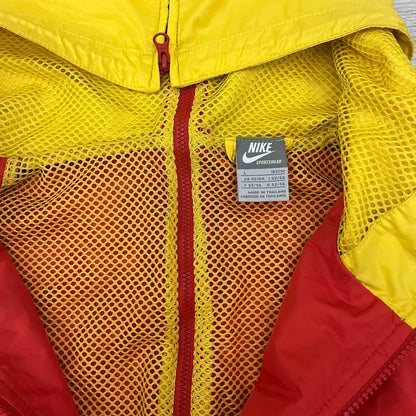 Nike China Olympics Split Windbreaker from 2008, crafted in red with a yellow hood representing China colors. This innovative jacket can be zipped apart on both sides and merged with other compatible models. This jacket doesn't have typical flags in the pockets.