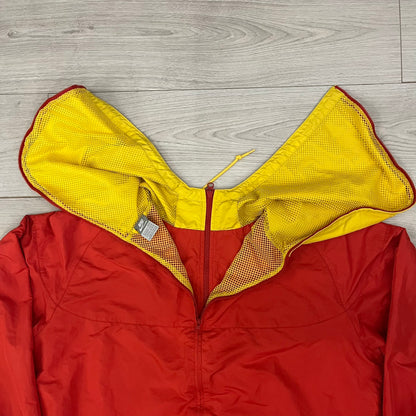 Nike China Olympics Split Windbreaker from 2008, crafted in red with a yellow hood representing China colors. This innovative jacket can be zipped apart on both sides and merged with other compatible models. This jacket doesn't have typical flags in the pockets.