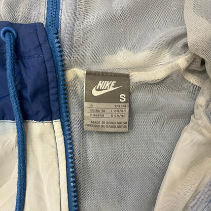 Nike Cloud Day Split Windbreaker from the 2010s in full blue with a photorealistic all-over cloud print. Features dual zippers on the front and back, allowing the jacket to split in half and merge with other compatible pieces. Made from 100% nylon.