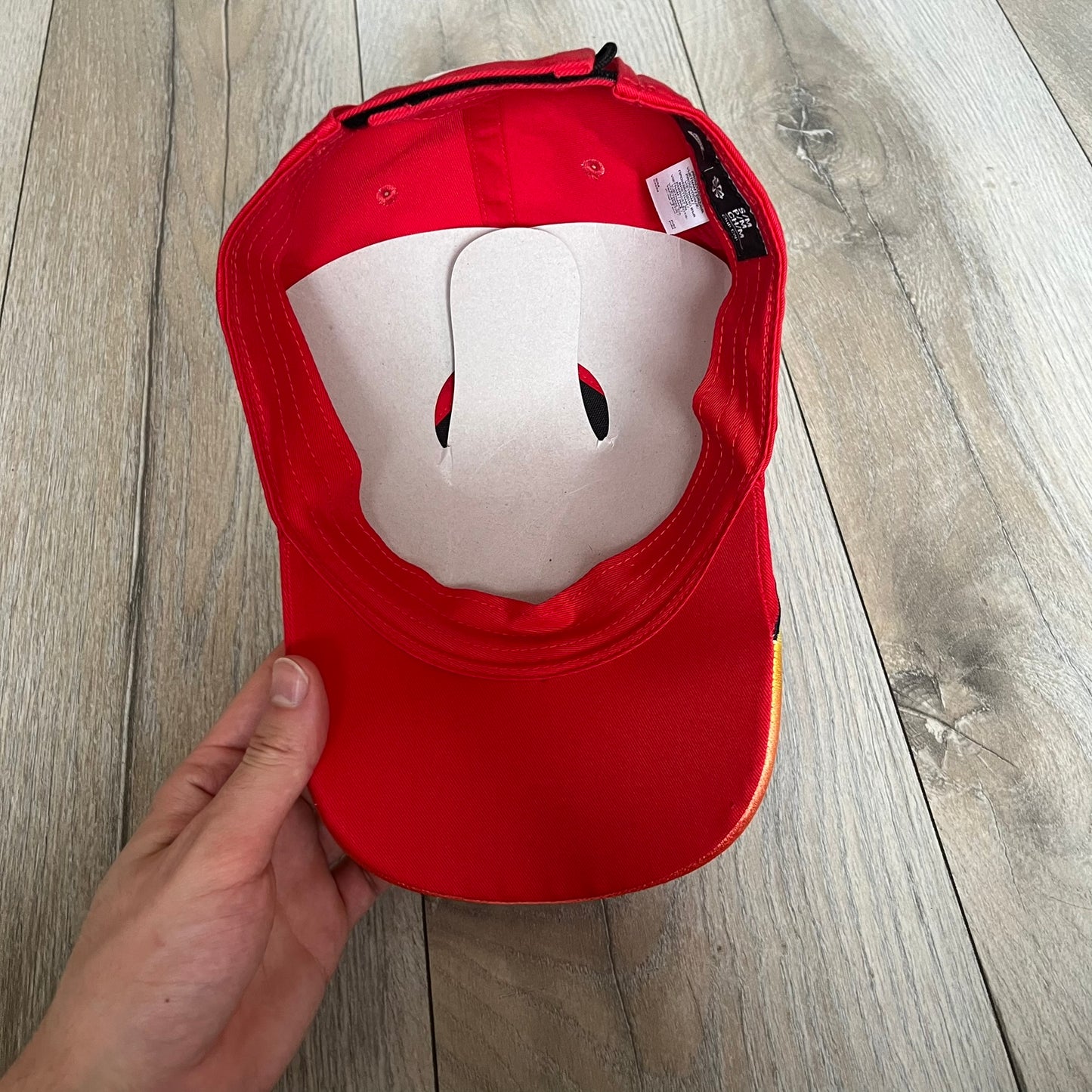 Nike Club Semi-Structured OG University Red Flame Cap is a red baseball cap featuring a white Nike Swoosh centered on the front panel. Embroidered flame graphics in orange, yellow, and red extend across the front of the visor and side panels. A small white Nike Swoosh is placed at the back. The design is identified by code IH9258-657.&nbsp;
