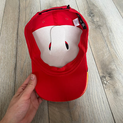 Nike Club Semi-Structured OG University Red Flame Cap is a red baseball cap featuring a white Nike Swoosh centered on the front panel. Embroidered flame graphics in orange, yellow, and red extend across the front of the visor and side panels. A small white Nike Swoosh is placed at the back. The design is identified by code IH9258-657.&nbsp;