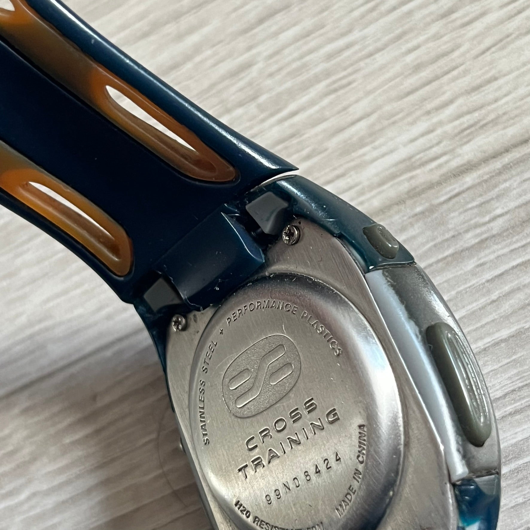 Nike Sports Chrono Cross Training Watch (WX0015) featuring a unique ana-digi “Covert” design with a partial hood over the analog dial. The display combines a three-hand analog setup with a curved dual-section LCD showing time, day, and mode. Water-resistant up to 50m and equipped with chronograph, timer, alarm, and dual-time functions, this model reflects Nike’s peak era of performance-driven digital innovation.