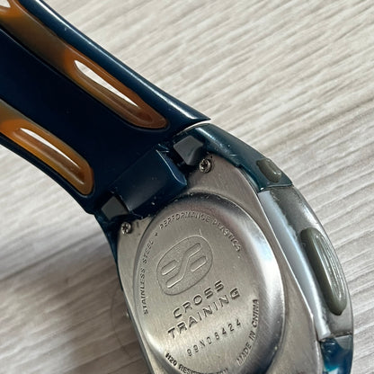 Nike Sports Chrono Cross Training Watch (WX0015) featuring a unique ana-digi “Covert” design with a partial hood over the analog dial. The display combines a three-hand analog setup with a curved dual-section LCD showing time, day, and mode. Water-resistant up to 50m and equipped with chronograph, timer, alarm, and dual-time functions, this model reflects Nike’s peak era of performance-driven digital innovation.