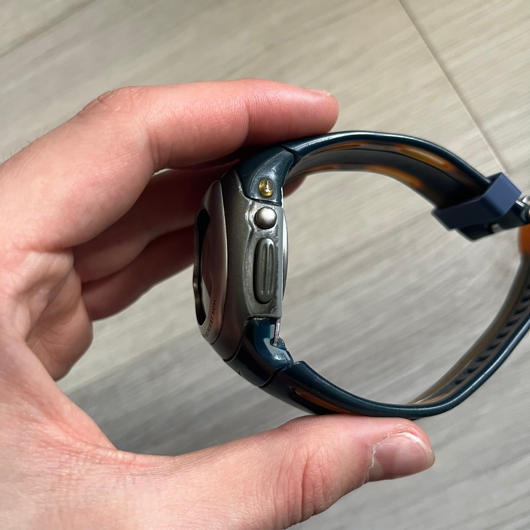 Nike Sports Chrono Cross Training Watch (WX0015) featuring a unique ana-digi “Covert” design with a partial hood over the analog dial. The display combines a three-hand analog setup with a curved dual-section LCD showing time, day, and mode. Water-resistant up to 50m and equipped with chronograph, timer, alarm, and dual-time functions, this model reflects Nike’s peak era of performance-driven digital innovation.