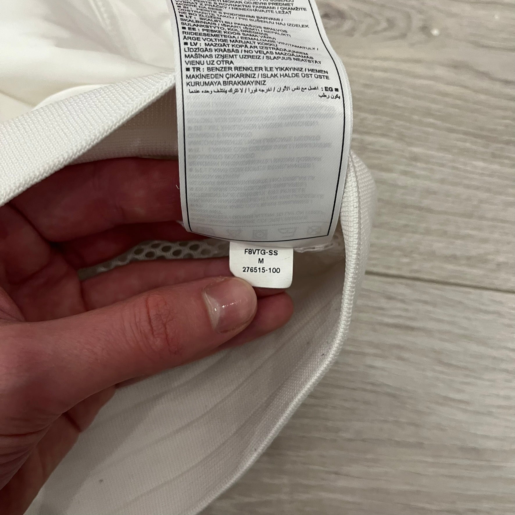 The Nike France Olympics 2008 Split Windbreaker made in a white, red, and navy color block representing France, it includes a red embroidered Nike logo and hidden French flags inside both pockets. It features a modular design by Jarrett Reynolds, allowing the jacket to split on both sides via dual zippers.