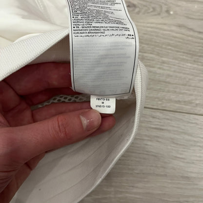 The Nike France Olympics 2008 Split Windbreaker made in a white, red, and navy color block representing France, it includes a red embroidered Nike logo and hidden French flags inside both pockets. It features a modular design by Jarrett Reynolds, allowing the jacket to split on both sides via dual zippers.