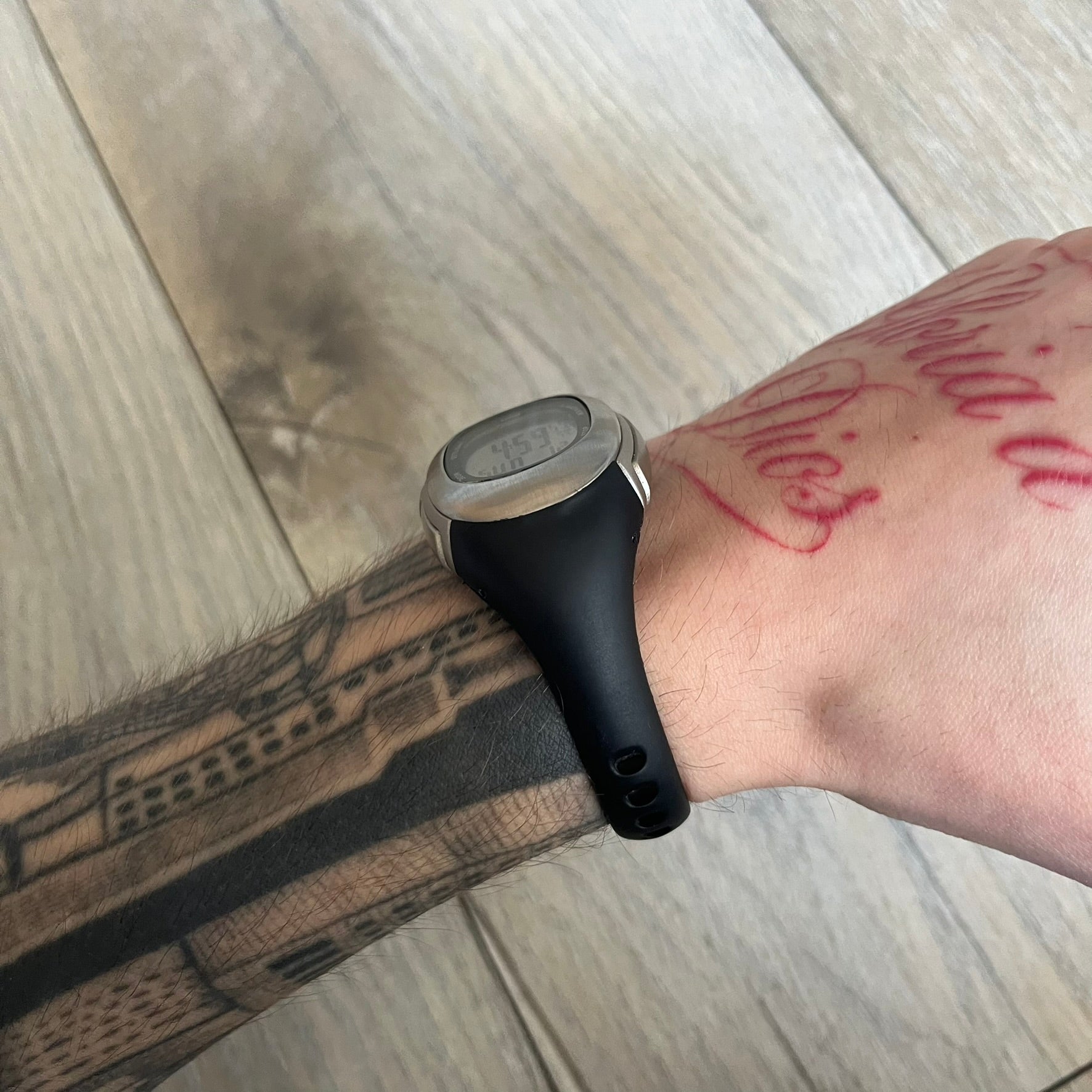 Nike Imara HRM SM0032 Digital Watch is a digital wristwatch featuring a silver case with gray-outlined display and a black rubber strap. The watch includes backlight functionality, multiple modes, and a chest heart rate monitor, with water resistance up to 59 meters. It comes with original box, papers, and a plastic store display.