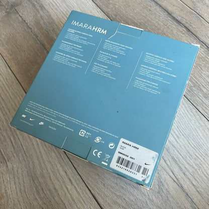 Nike Imara HRM SM0032 Digital Watch is a digital wristwatch featuring a silver case with gray-outlined display and a black rubber strap. The watch includes backlight functionality, multiple modes, and a chest heart rate monitor, with water resistance up to 59 meters. It comes with original box, papers, and a plastic store display.