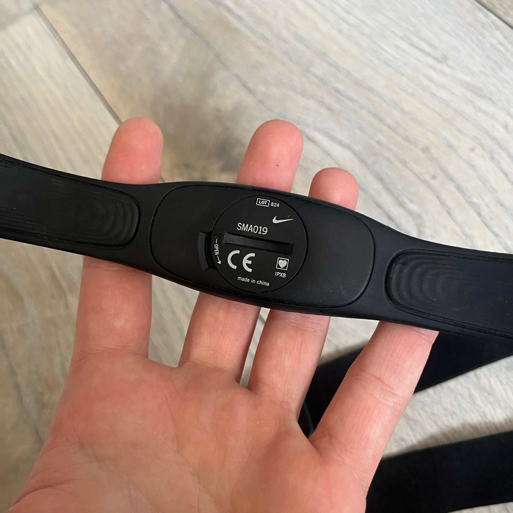 Nike Imara HRM SM0032 Digital Watch is a digital wristwatch featuring a silver case with gray-outlined display and a black rubber strap. The watch includes backlight functionality, multiple modes, and a chest heart rate monitor, with water resistance up to 59 meters. It comes with original box, papers, and a plastic store display.