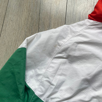 Nike Italy Olympics Split Windbreaker from 2008, created by designer Jarrett Reynolds. Crafted in green/white/red, with a green lower half of the front and sleeves, white upper half and red hood. This innovative jacket can be zipped apart on both sides and merged with other compatible models. Hidden inside, a small Italy flags accent completes the concept.